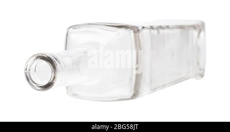 overturned empty clear wine bottle isolated on white background Stock Photo