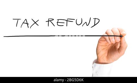 Close up view of the hand of a man writing - Tax refund - on a blank white virtual screen with a marker. Stock Photo