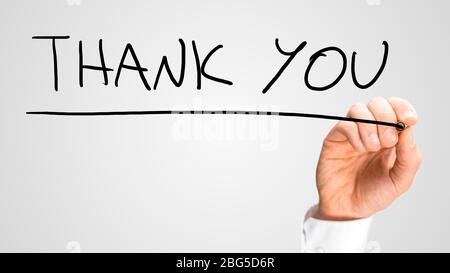 Male hand writing Thank you on virtual screen. Stock Photo