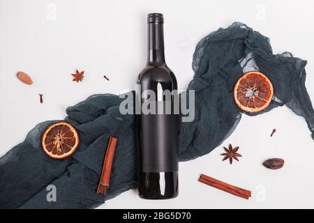 Bottle of wine, corkscrew and grape on wooden background Stock Photo
