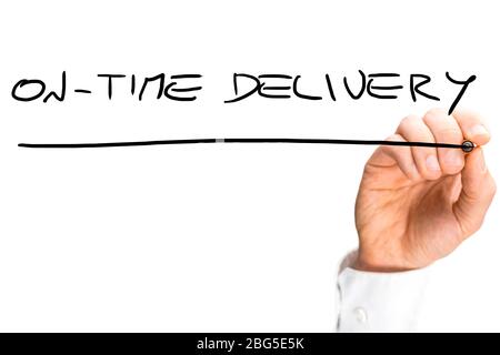 Man writing a handwritten message - On time delivery - with a black marker on a blank white virtual interface with copyspace. Stock Photo