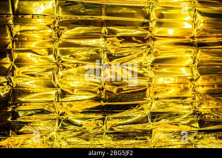 abstract Crumpled golden foil backgound Stock Photo