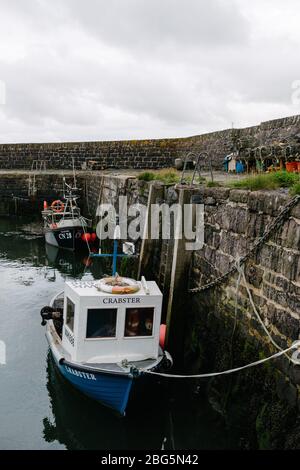 North Sea creel fishing boat called Crabster tied up in the harbour in Keiss, Pentland, Scotland. Stock Photo