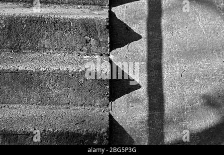 Detail of an old concrete stairway in black and white Stock Photo