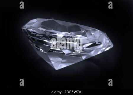 Large sparkling diamond isolated on black background Stock Photo