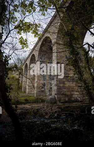 An old stone built British viaduct in the Yorkshire countryside Stock Photo