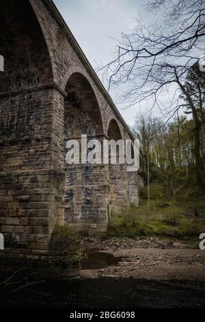 An old stone built British viaduct in the Yorkshire countryside Stock Photo