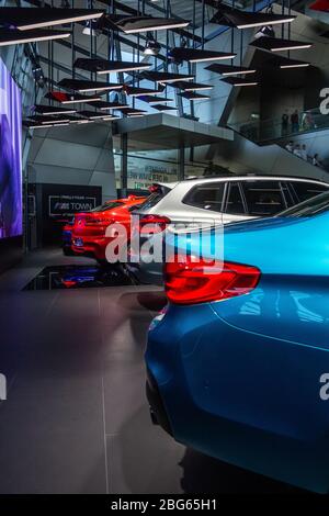 Rear lights of blue BMW M5, grey X3M, red X4M competition , München, Germany, March 2020 Stock Photo