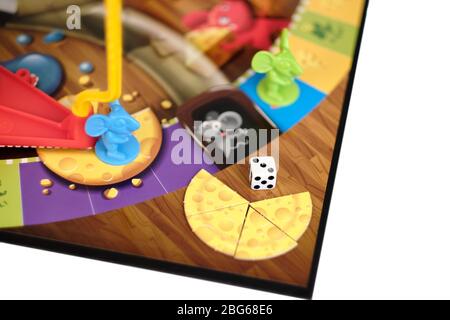 Close up of assembled Hasbro Mouse trap board game with one mouse at bottom of cage pole and view of other mouse cheese peieces and dice Stock Photo