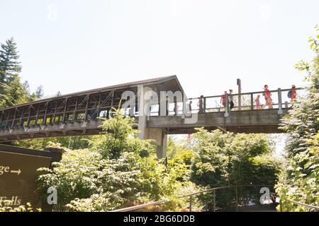 People crossing brdige Stock Photo