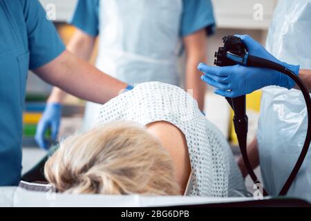 Patient and doctor in hospital during colonoscopy Stock Photo