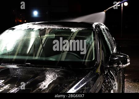 Pressure foam sprayer on car wash Stock Photo - Alamy