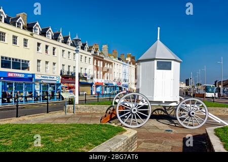 Weymouth, Dorset, UK - October 10 2018: A replica of the horse-drawn bathing machine used by King George III who was a frequent visitor to Weymouth Stock Photo