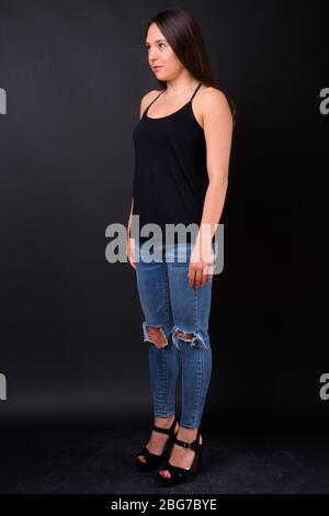 Studio shot of beautiful young Chinese woman Stock Photo - Alamy