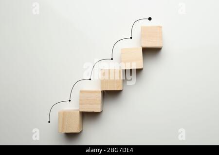 Growth concept by career ladder. Wooden cubes to the top. Close up. Stock Photo