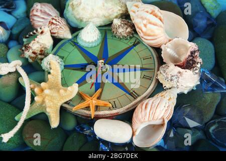 Clock on sea bottom with shells and stones Stock Photo