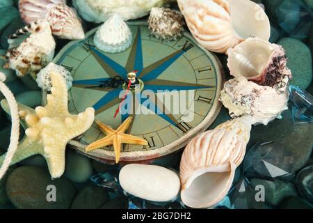 Clock on sea bottom with shells and stones Stock Photo