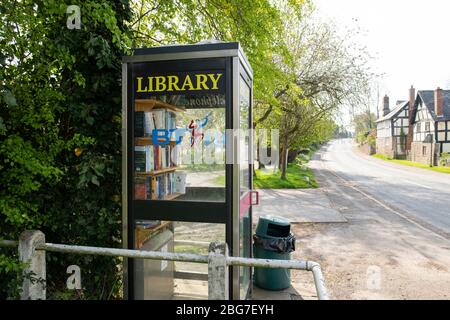 A former telephone box turned in to a library in the village of Eye in Worcestershire Stock Photo