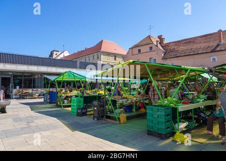 Maribor, Slovenia - August 09, 2019: Vegetable Market with stalls, shopping arcade, sellers and shoppers in Maribor, Slovenia Stock Photo
