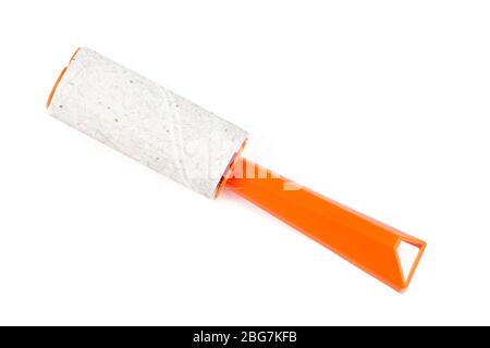 used orange single-use sticky cleaning roller with some hair and fur isolated on white background Stock Photo