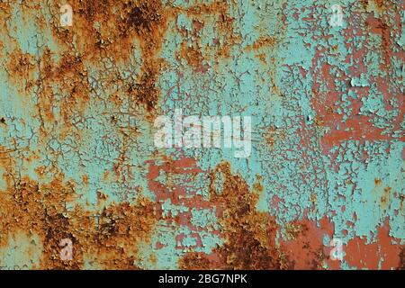 Metal rusty surface with shabby background paint. Texture blue cracked paint on an iron sheet. Fragment of an old metal gate, Metal Corrosion Stock Photo