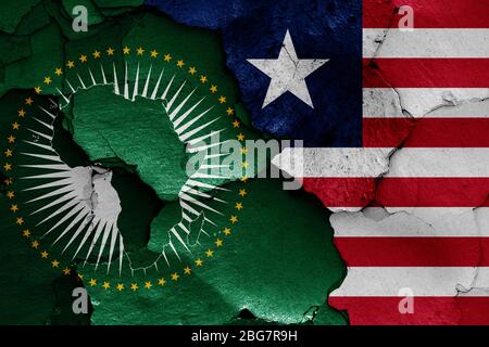 flags of African Union and Liberia painted on cracked wall Stock Photo