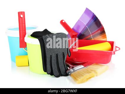 Plastic bucket with paint, roller, brushes and bright palette of colors isolated on white Stock Photo