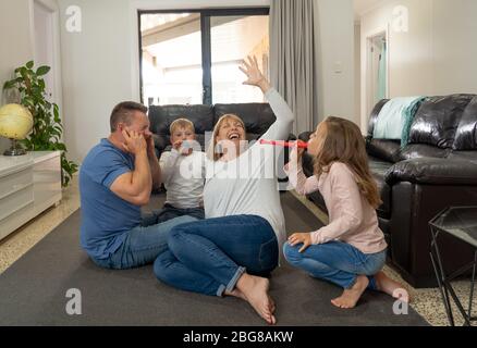 COVID-19 Isolation and mental health. Stressed out parents struggling with having the children at home during Coronavirus lockdown. Mother and father Stock Photo