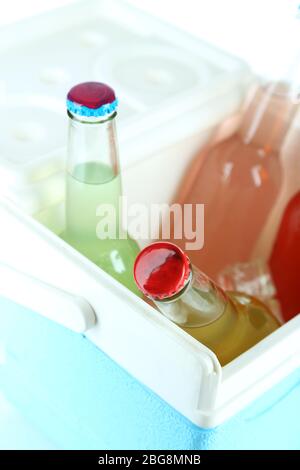 Drinks in glass bottles in mini fridge close up Stock Photo