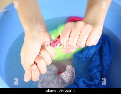 Hand washing in plastic bowl close-up Stock Photo