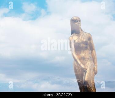 Double exposure photo of Tatsuko golden statue at Lake Tazawa, Akita, Japan. Stock Photo