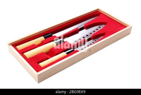 Set of kitchen knives in wooden box isolated on white Stock Photo