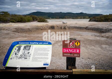 Danger and information signs at Cameron's Laughing Gas Pools, Sulphur Point Walk, Rotorua, North Island, New Zealand Stock Photo