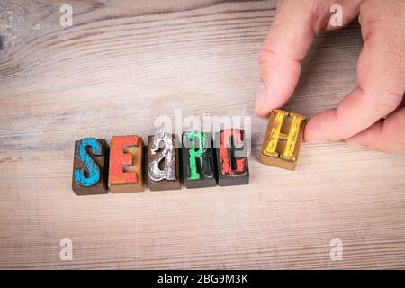 SEARCH. Internet, science, health and service concept. Colored wooden letters on a light background Stock Photo
