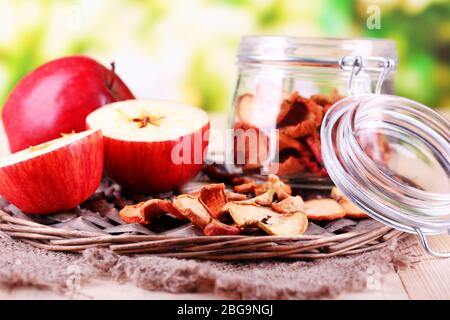 Dried apples in glass jar, on   bright background Stock Photo