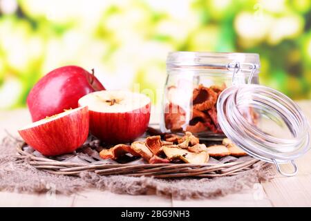 Dried apples in glass jar, on   bright background Stock Photo