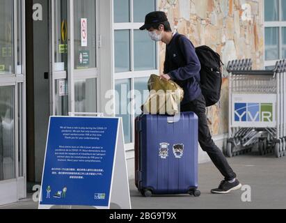 Vancouver, Canada. 20th Apr, 2020. A travellers wearing face mask is seen at the arrival hall of Vancouver International Airport in Richmond, Canada, April 20, 2020. Credit: Liang Sen/Xinhua/Alamy Live News Stock Photo