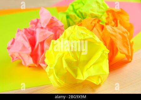 Colorful crumpled paper balls on table close up Stock Photo