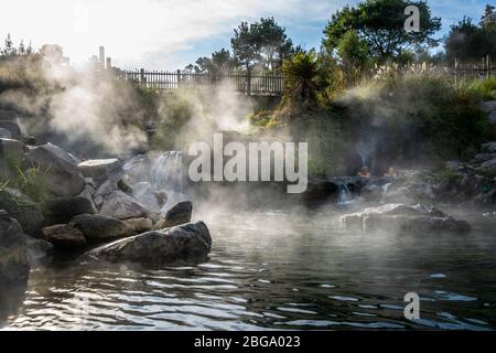 Hot water from Otumuheke Stream running into Waikato River at Spa Thermal Park, Taupo, North Island, New Zealand Stock Photo