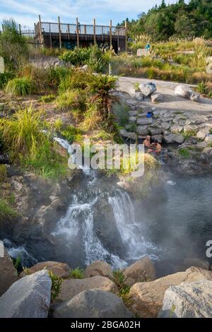 Hot water from Otumuheke Stream running into Waikato River at Spa Thermal Park, Taupo, North Island, New Zealand Stock Photo
