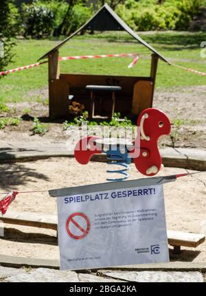 Berlin, Germany. 17th Apr, 2020. Barrier tapes and a sign 'Spielplatz gesperrt' (playground closed) are attached to a playground in Charlottenburg. Due to the Corona epidemic, playgrounds are closed. There is a ban on contact for more than two people. Credit: Jens Kalaene/dpa-Zentralbild/dpa/Alamy Live News Stock Photo