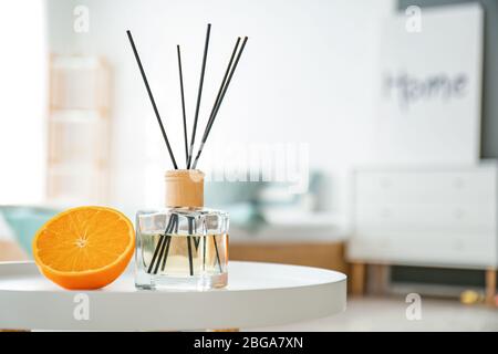 Reed diffuser on table in bedroom Stock Photo