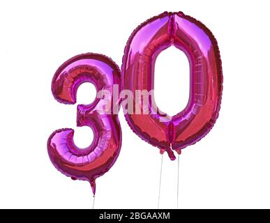 pink helium balloons number 30 thirty isolated on white background Stock Photo