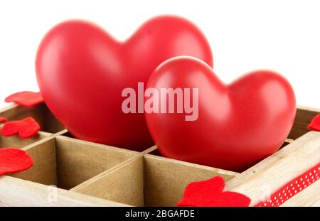 Hearts in wooden casket, isolated  on white background Stock Photo