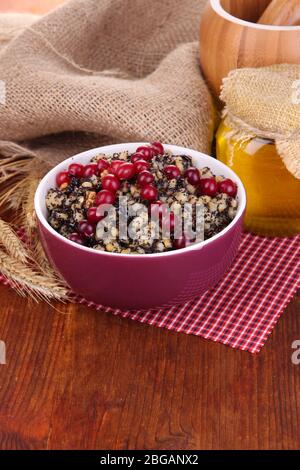 Bowl with kutia -  traditional Christmas sweet meal in Ukraine, Belarus and Poland, on wooden background Stock Photo