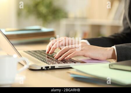 Close up of entrepreneur woman hands working typing on laptop on a desk at home Stock Photo