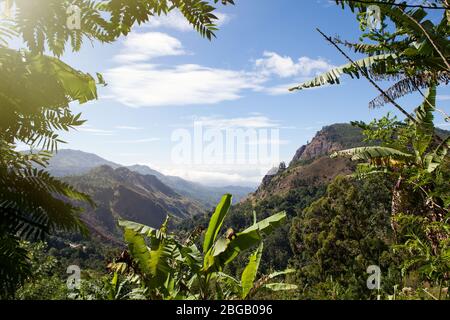 Beautiful scenery and clear mountain views. Blue sky, mountains and greenery. Ella, Sri Lanka. Mountain panorama. Valley and vegetation. Stock Photo