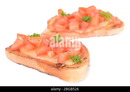 Delicious bruschetta with tomatoes isolated on white Stock Photo