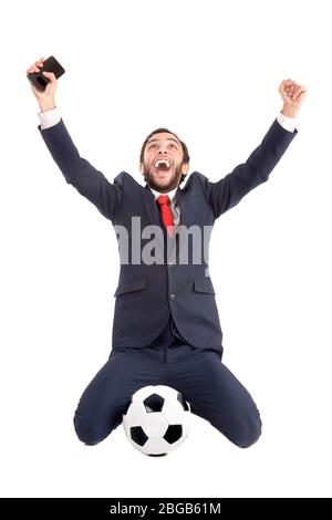 Businessman with soccer ball celebrating isolated in white Stock Photo