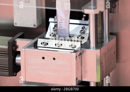 Dry Food automatic packing machine using aluminium foil sheet ;industrial equipment background Stock Photo